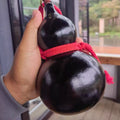 Urushi lacquer gourd bottle showing traditional hand-applied natural lacquer texture